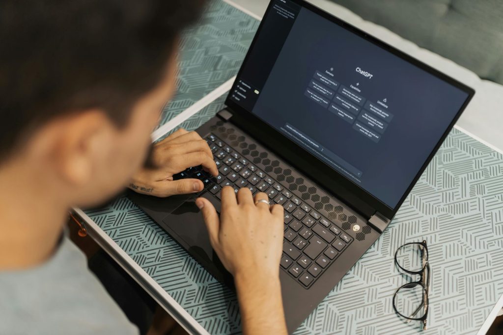 man at a computer using AI tools 