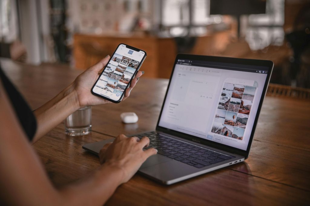 computer and mobile phone showing social media