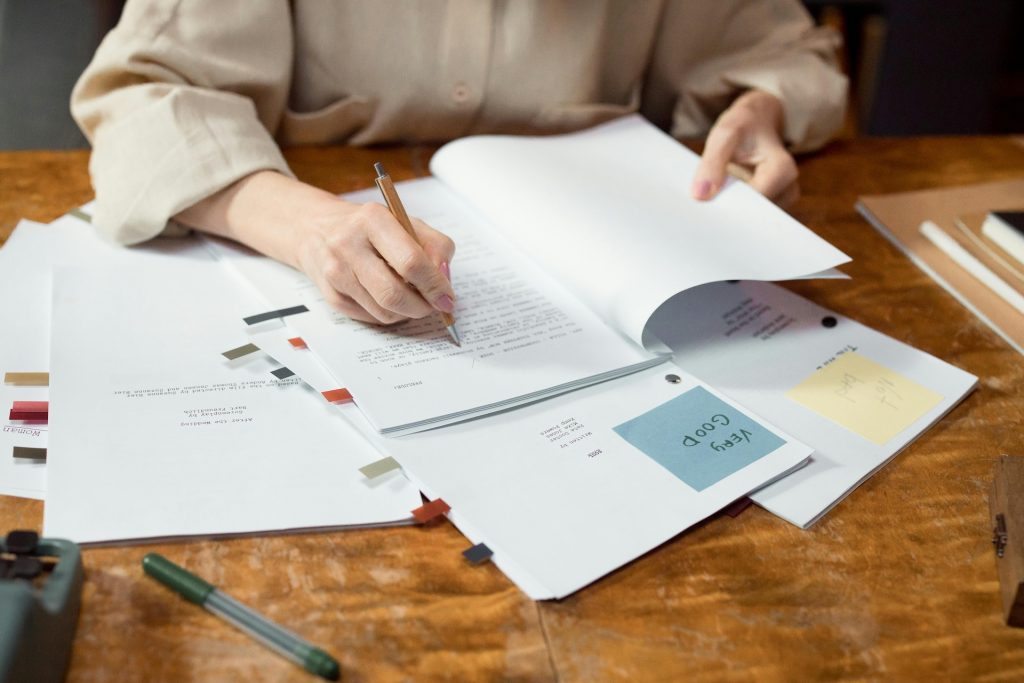 documents in desk being edited and proofread