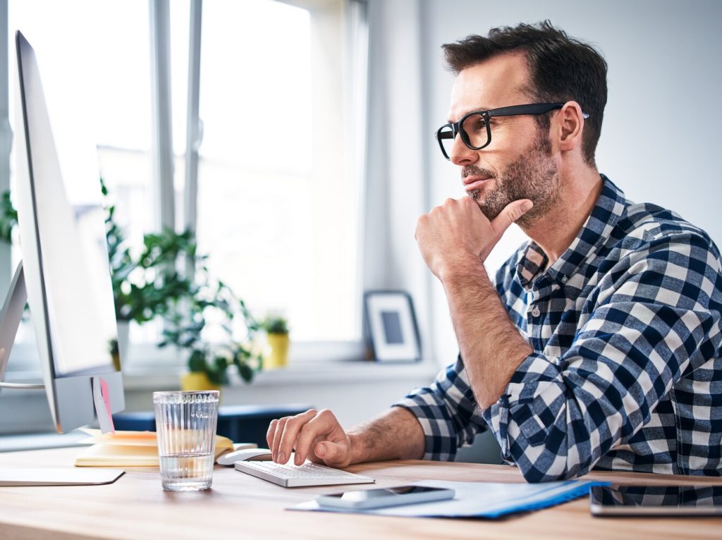 man researching proofreading jobs
