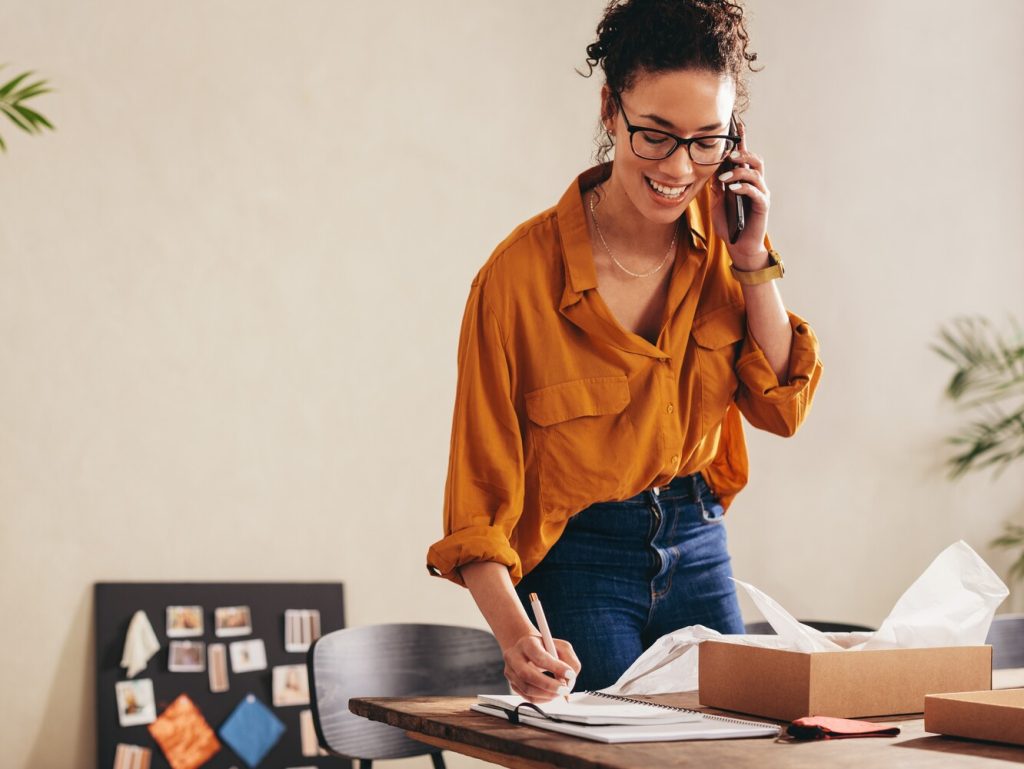 business owner confirming the order on phone