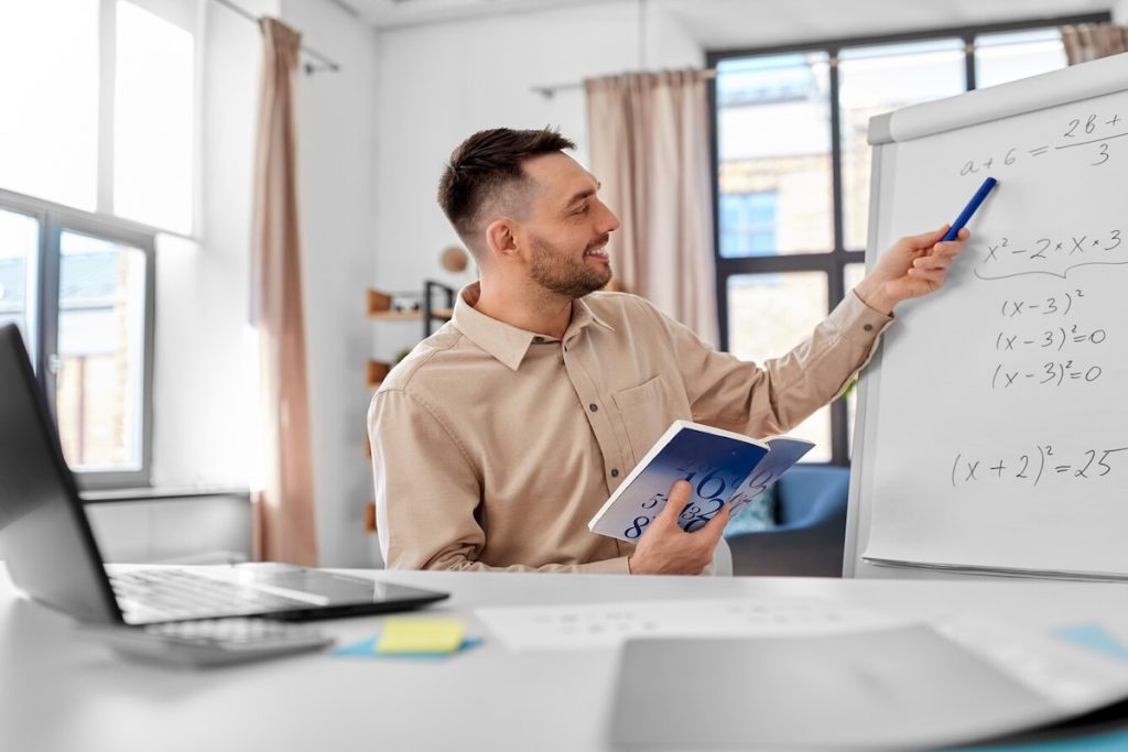 math tutor teaching online lesson at whiteboard
