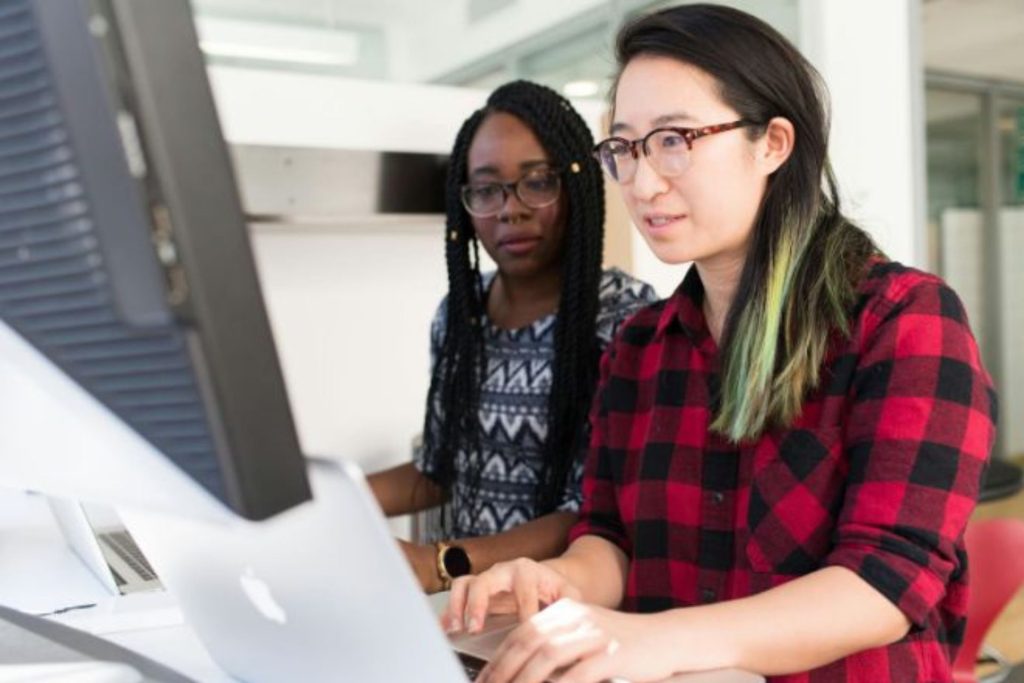 woman giving technical support on a computer
