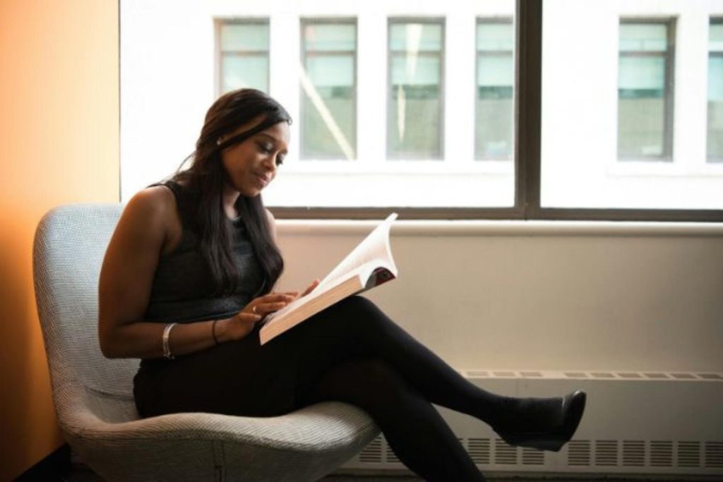 woman proofreading a book