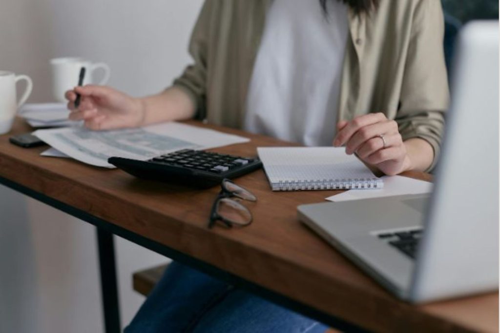 person sitting at a desk doing accounting