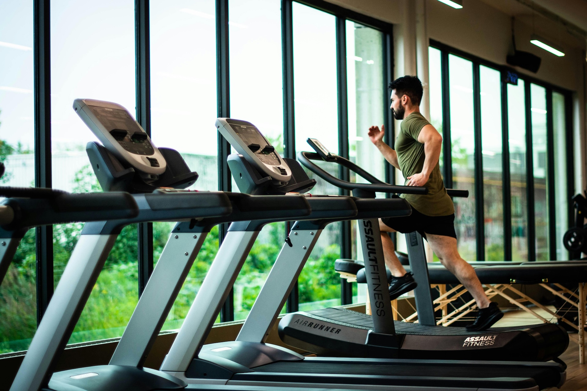 man running on a treadmill alone