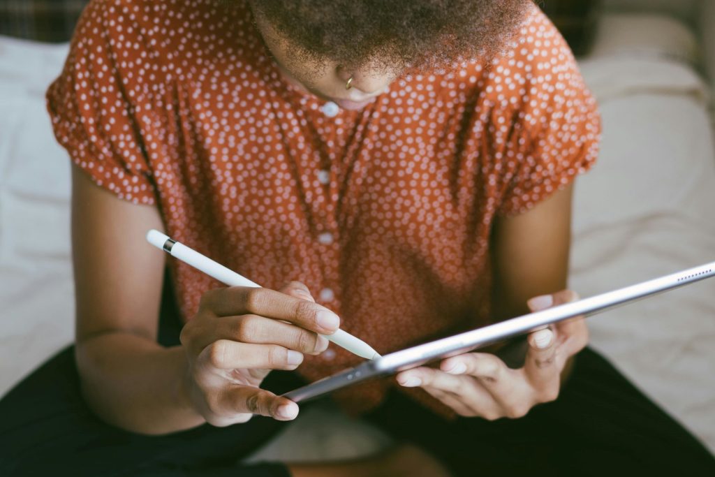 Lady proofreading an article on a tablet