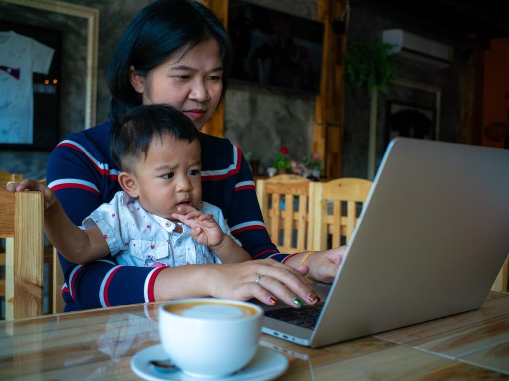 mom proofreading with child in restaurant