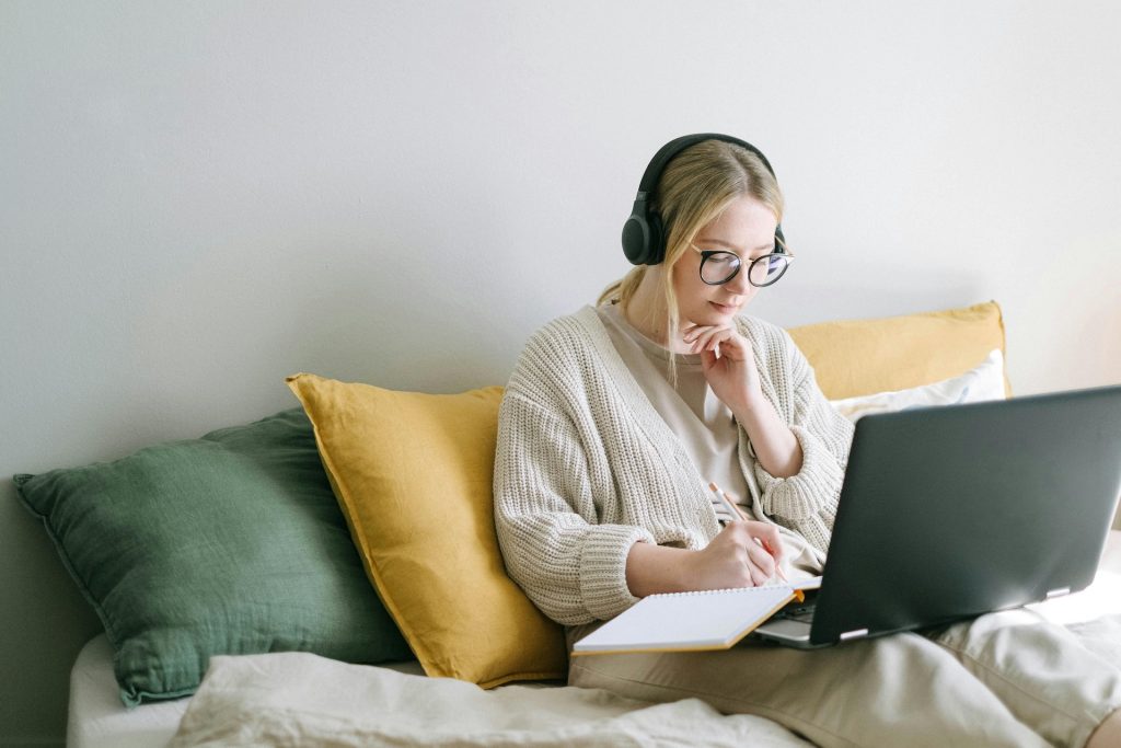 woman working at home with headphones