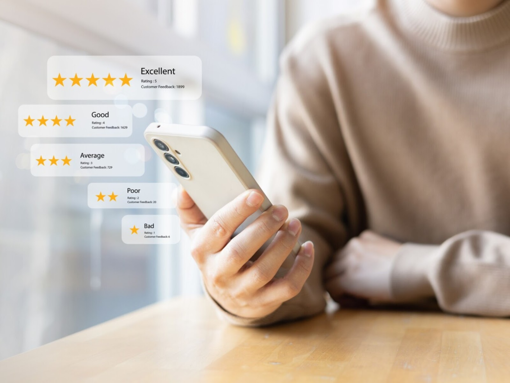 woman holding phone and looking at reviews